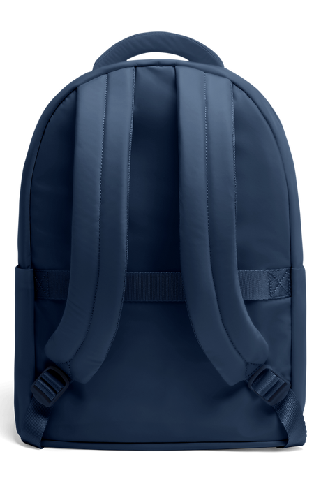 Back view of a stylish Lipault City Plume backpack in navy blue, showcasing padded straps and modern design.