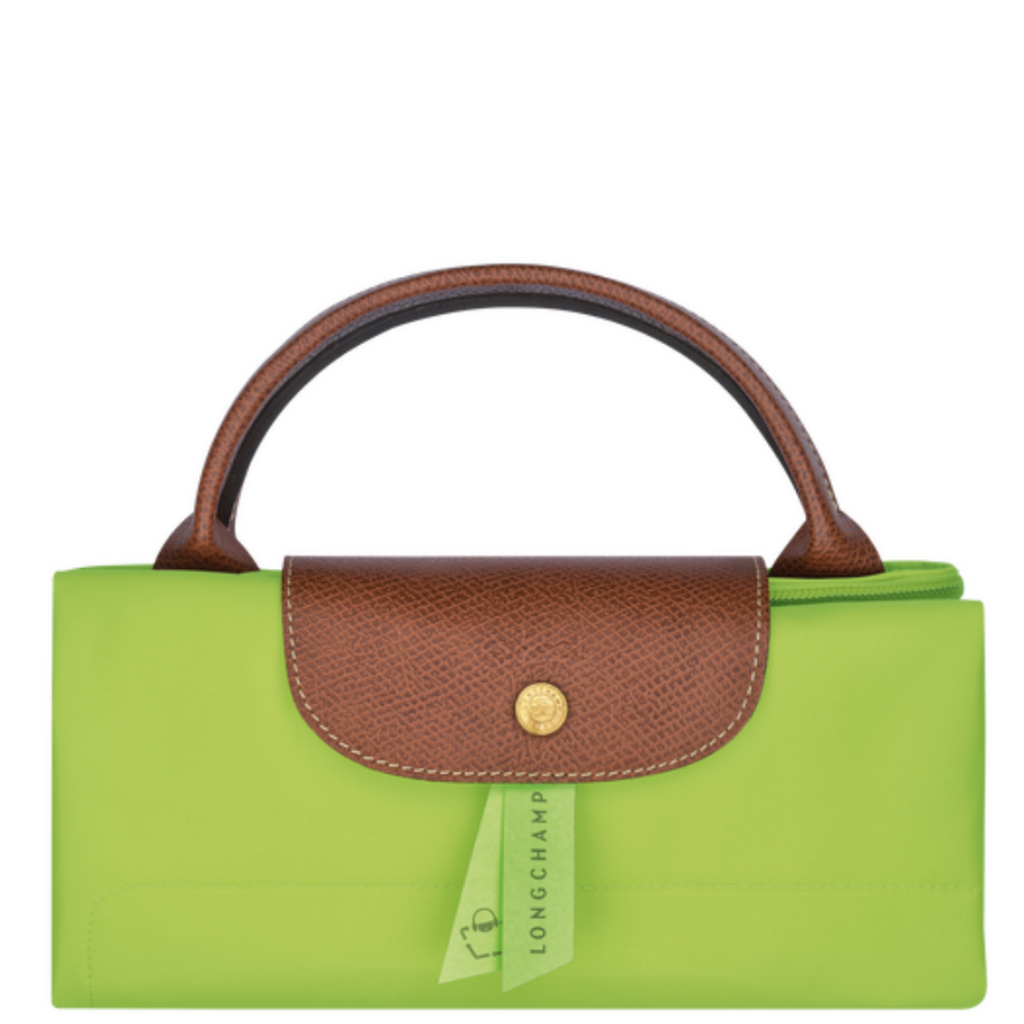 Grand sac de voyage en toile et cuir LONGCHAMP gamme Le Pliage Original couleur vert clair