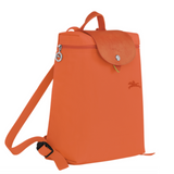Sac à dos en toile et cuir LONGCHAMP gamme Le Pliage Green couleur orange carotte