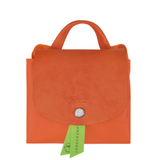 Sac à dos en toile et cuir LONGCHAMP gamme Le Pliage Green couleur orange carotte