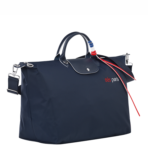 Sac de voyage en toile LONGCHAMP gamme Le Pliage Très Paris couleur bleu marine