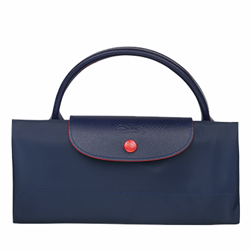 Grand sac de voyage en toile et cuir LONGCHAMP gamme Le Pliage Club couleur bleu marine