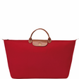Grand sac de voyage en toile et cuir LONGCHAMP gamme Le Pliage Original couleur rouge
