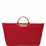 Grand sac de voyage en toile et cuir LONGCHAMP gamme Le Pliage Original couleur rouge